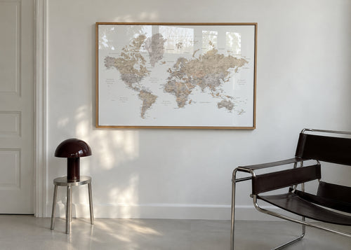 Detailed taupe watercolor world map with labels in Spanish, Abey - Framed poster in an interior