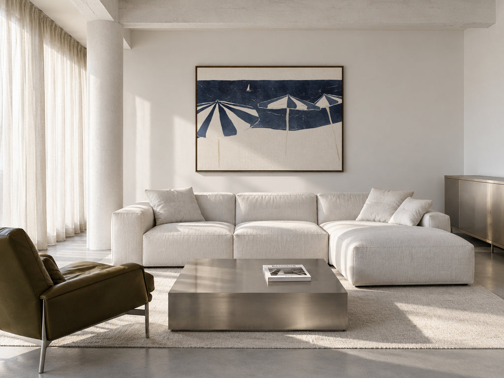 Blue Umbrellas and Sailboat - Framed canvas in an interior