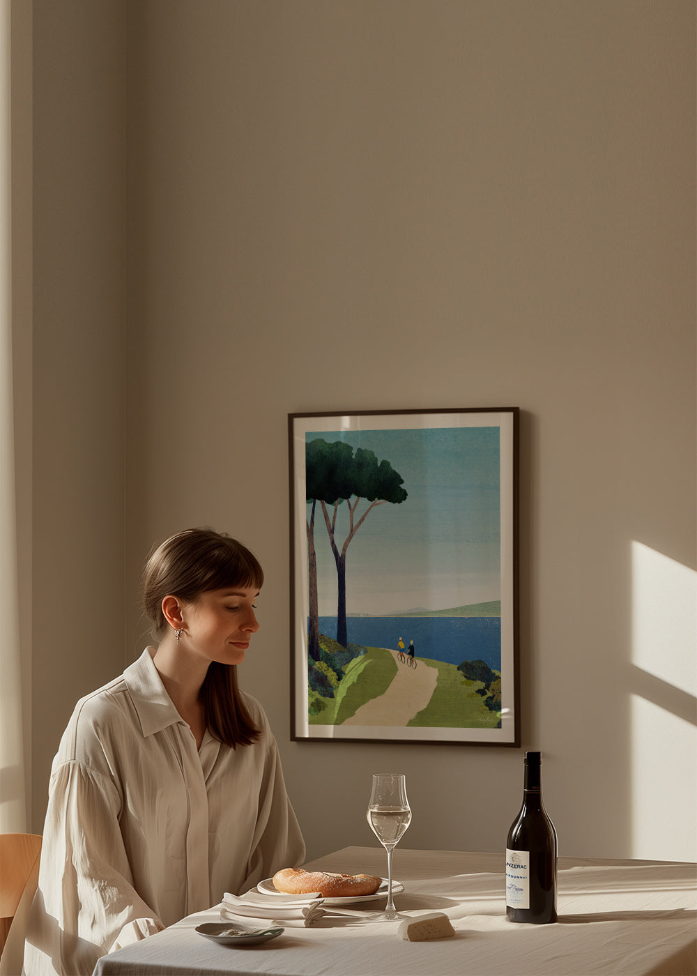 Cycling by the sea - Framed poster in an interior