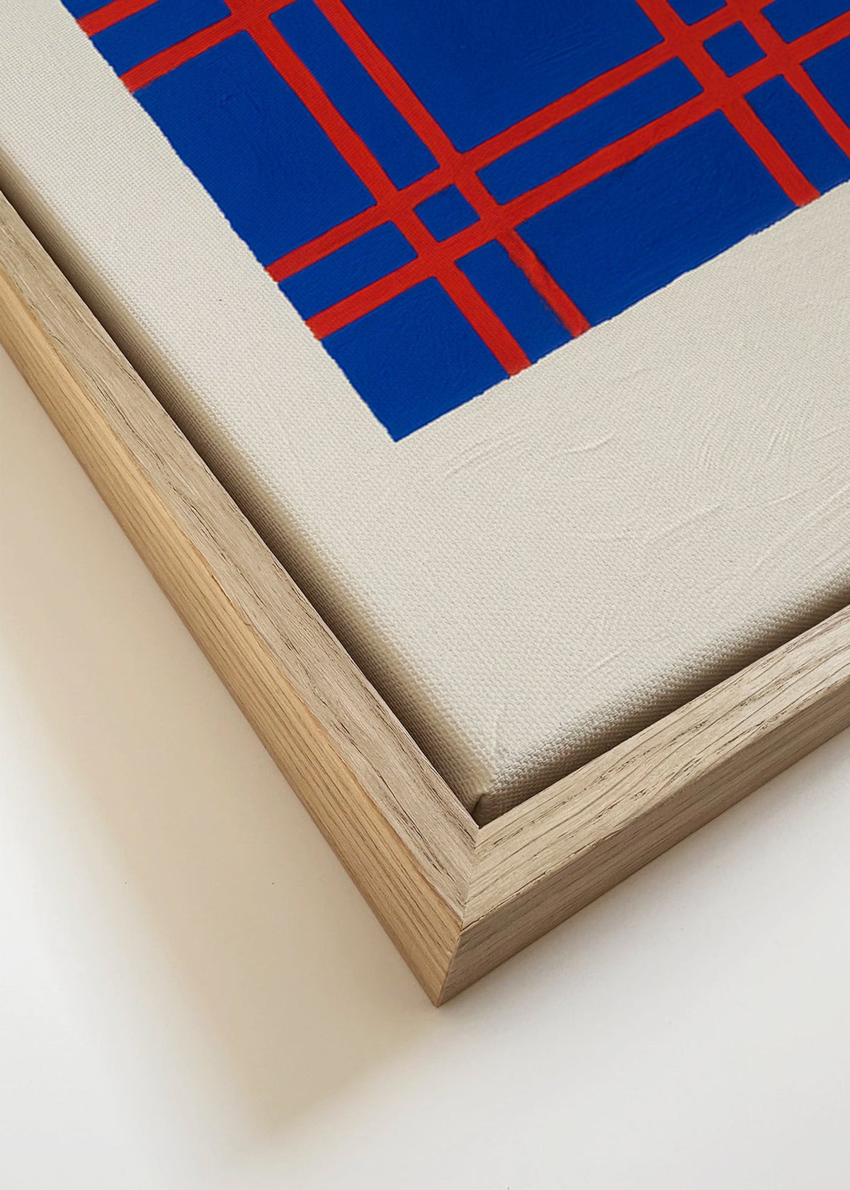 Obraz geometryczny niebieski z czerwoną kratą – Canvas detail